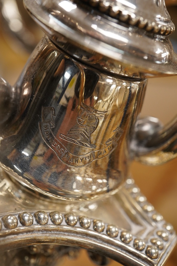 A garniture of 19th century silver plated Corinthian column candelabra, comprising a pair of two branch, three light candelabra and matching four branch, five light candelabrum, with detachable acanthus leaf capped scrol